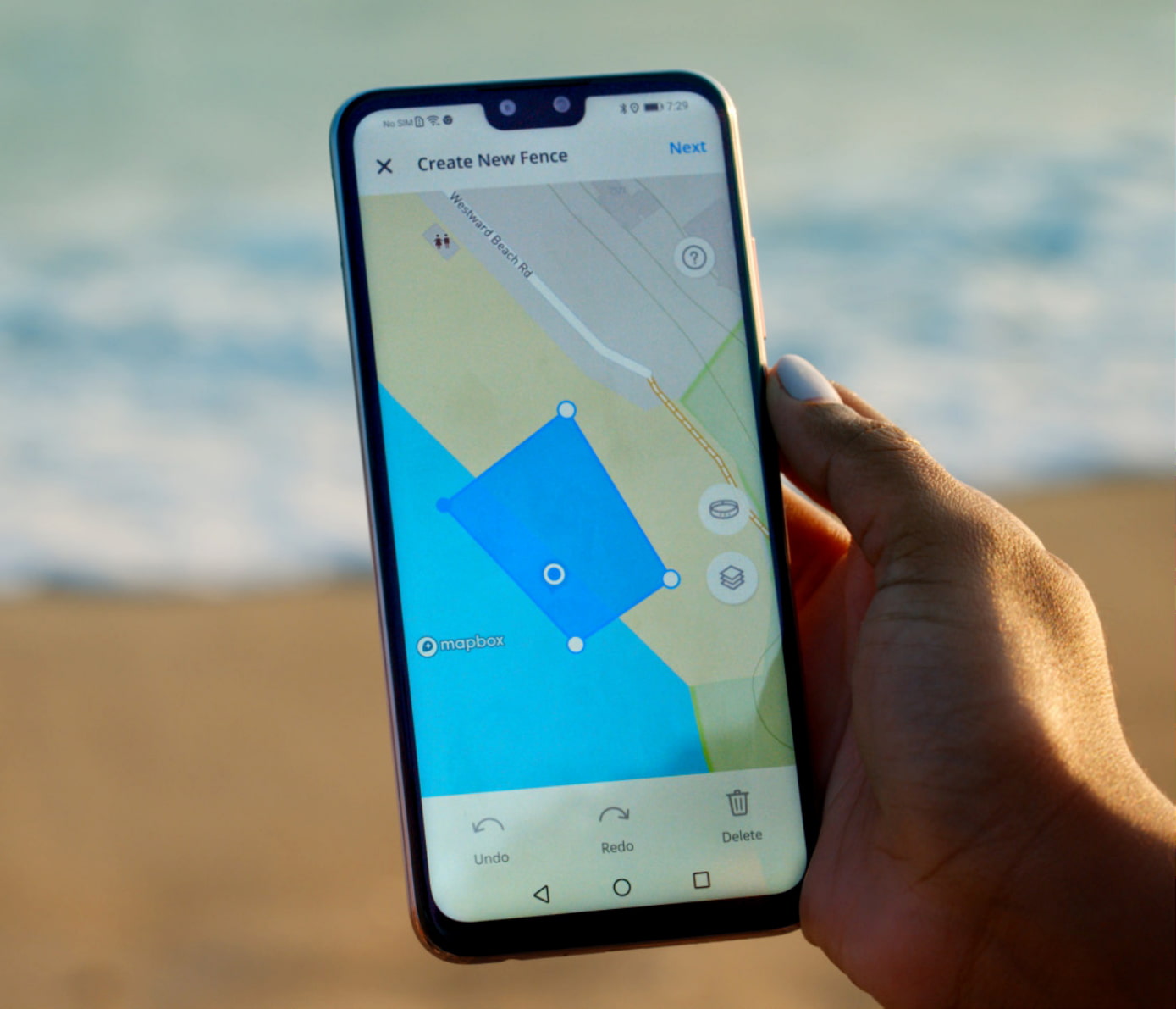 reading-app-on-beach Setting invisible fence on the beach